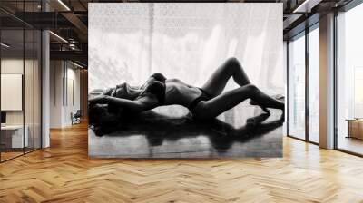 Sensual woman posing by window with sexy lingerie Wall mural