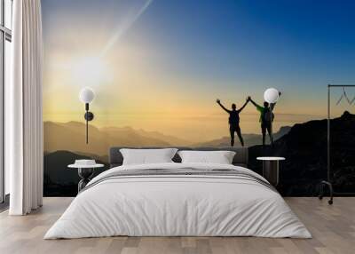 Couple hikers success and trust concept in mountains Wall mural