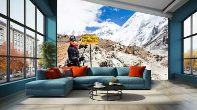 Woman hiker walking in Himalaya Mountains, Nepal Wall mural