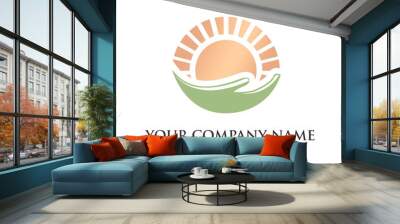 Vector logo with hand holding sun Wall mural