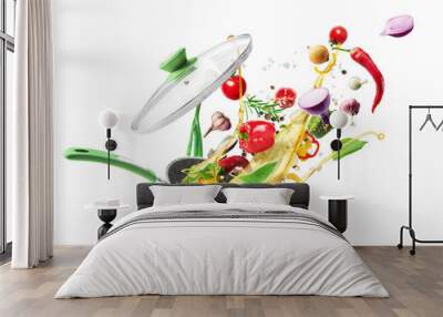 Cooking concept. Vegetables are flying out of the pan isolated on white background. Healthy food. Wall mural