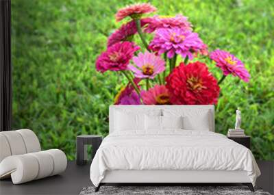 a canning jar full of zinnia flowers Wall mural