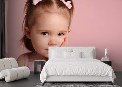 Cute toddler girl posing on pink Wall mural