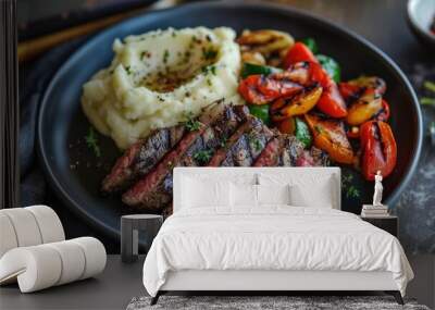 A plate of vegetables and charred  steak, seasoned with herbs and spices. The dish looks delicious and appetizing Wall mural