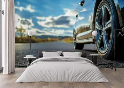 car on black asphalt road with tire wheel Wall mural