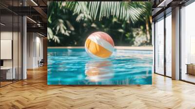 Sun soaked, Colorful inflatable beach ball floating in swimming pool, summer vacation concept. Wall mural