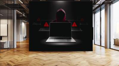 Crime and attack technology concept by hacker , Grey laptop with black blank screen and red hacker blurred in a black darkness background with lights shining down from above. Wall mural