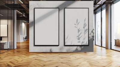 Two blank vertical and horizontal poster mockups featuring soft shadows set against a light grey concrete background Flat lay perspective Wall mural