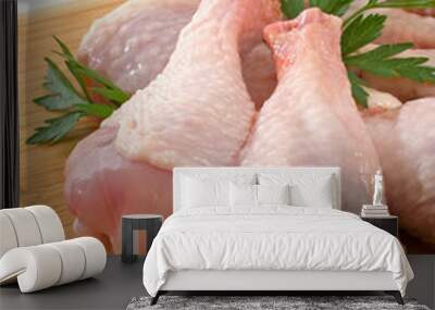 Fresh raw chicken legs on wooden board Wall mural