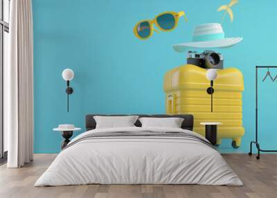 Vibrant summer vacation concept with yellow suitcase and accessories, ideal for travel and tourism advertising. Wall mural