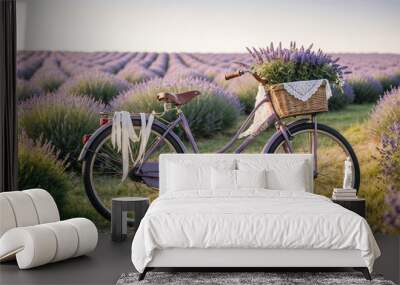 Purple retro bicycle standing in beautiful lavender field at sunset Wall mural