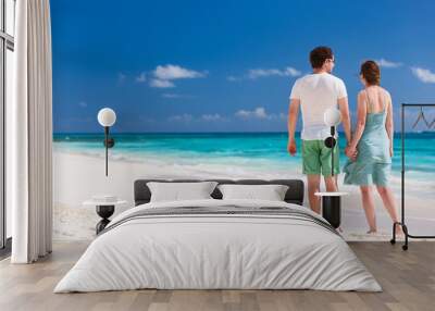 Couple at tropical beach Wall mural