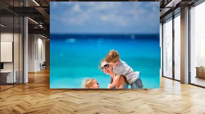 Mother and two kids at beach Wall mural