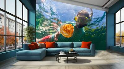 tourist snorkeling in jellyfish lake Wall mural