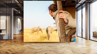 Woman on safari game drive Wall mural