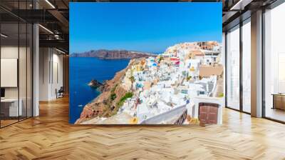 Young woman in Oia village Wall mural