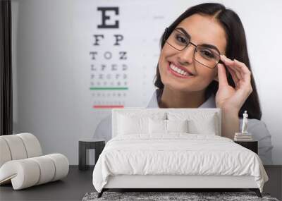 Portrait of happy smiling young woman. Wall mural