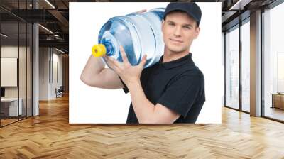 Water delivery. Cheerful young deliveryman holding a water jug w Wall mural