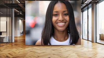 Young black woman in city smile happy face portrait Wall mural