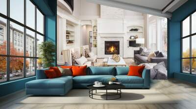 beautiful living room in new luxury home with fireplace and roaring fire. large bank of windows hint Wall mural