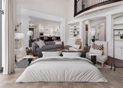 Beautiful living room interior with hardwood floors, view of kitchen and dining room in new luxury home Wall mural