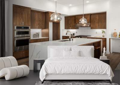 Kitchen in new luxury home with quartz waterfall island, hardwood floors, dark wood cabinets, and stainless steel appliances. Wall mural