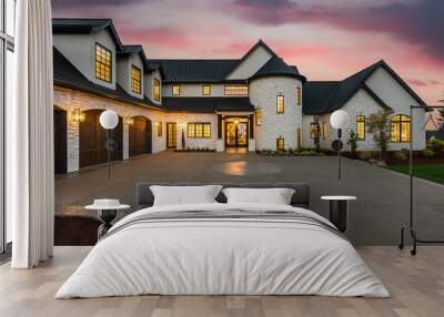 stunning luxury home exterior at sunset with colorful sky and expansive driveway. this mansion has t Wall mural