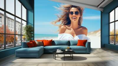  happy summer with a italian fashion model walking joyful along the beach wearing sun glasses Wall mural