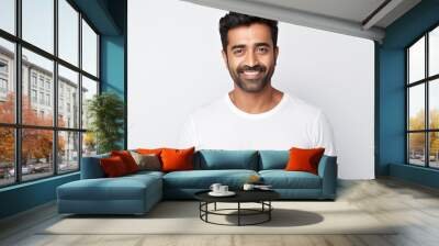 portrait of an attractive indian male in his 30s with a beard smile and looking into the camera isolated against a white background Wall mural