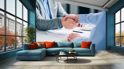 Businessmen handshaking over signed contract. Wall mural