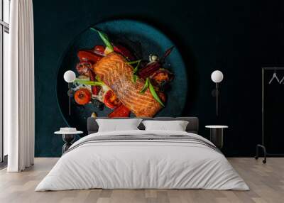 Delicious meal on a black plate, top view, copy space. Wall mural