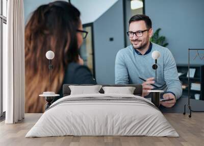 Female person having a job interview with a male recruiter. Wall mural