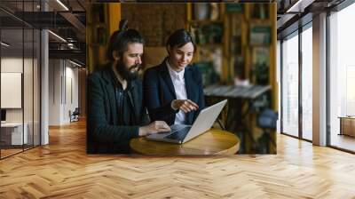 Focused caucasian business people meeting, pointing at screen. Wall mural