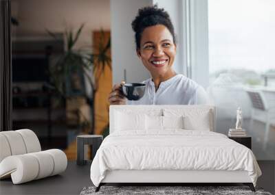 Happy black woman, enjoying in her cup of tea. Wall mural