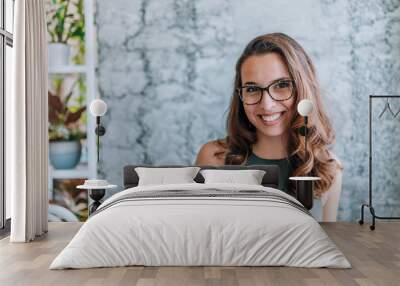 Headshot of gorgeous young woman with eyeglasses. Wall mural