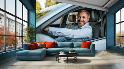 Man prepares to drive a car. Wall mural