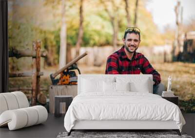 Outdoor portrait of a young countryman on autumn day. Wall mural