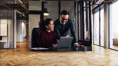 Portrait of a businesswoman having a training course with her male boss. Wall mural