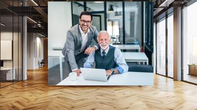 Portrait of successful business family at work. Wall mural