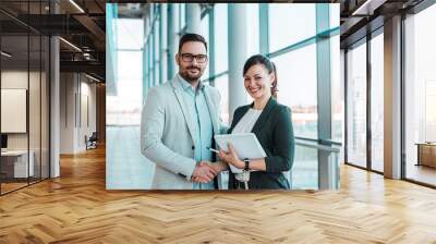 smiling business people handshake after successful negotiation. looking at camera. Wall mural