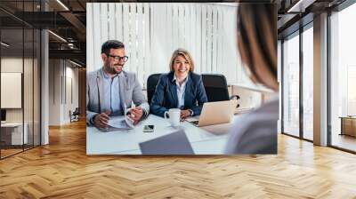 Two happy hr managers having interview with candidate. Wall mural