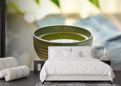 Cup of green tea on table Wall mural