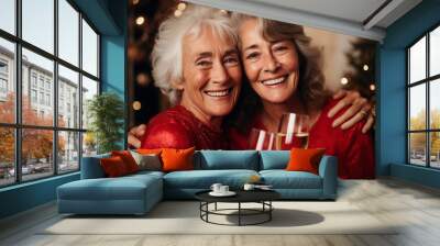 Portrait of happy beautiful young senior women celebrating Christmas Wall mural