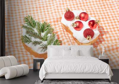 Christmas retro composition of two sandwiches with fir branches and red baubles on orange plaid kitchen towel. Minimal New Year celebrating concept. Vintage 50s aesthetic. Surreal party food idea. Wall mural