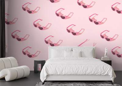 Minimal pattern made of pink sunglasses with sunlight shadow on pastel pink background. Creative summer concept. Wall mural