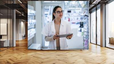 Optician at eyeglasses shop. Medical, health care concept Wall mural