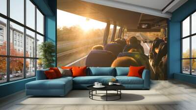 Background. Travel by bus. Bus interior. Salon of the bus with people fill the sun with light in the sunset. People travel on a big tourist bus. The bus rides along the mornings in the sunrise Wall mural