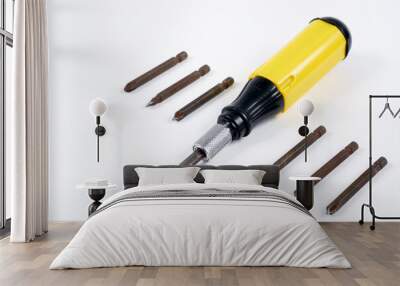 black and yellow screwdriver on white background Wall mural