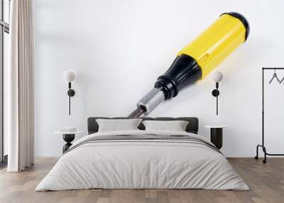 black and yellow screwdriver on white background Wall mural