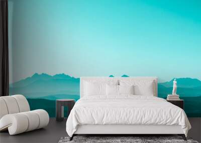 Green surreal mountains against the backdrop of a turquoise sky, fantastic fairytale mountain landscape Wall mural